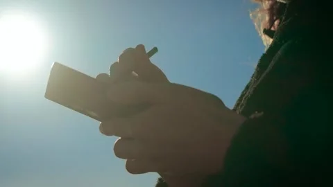 Ecommerce activity expanding through smartphone and stylus in bright outdoor Stock Footage 329786780