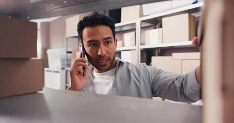 Ecommerce, boxes or man with phone call for inventory supplier, transport or Stock Footage 321400793