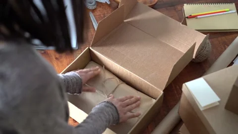 Ecommerce business entrepreneur preparing a package for delivery Stock Footage 149037983