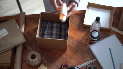 Ecommerce business entrepreneur preparing a package for delivery Stock Footage 149038168