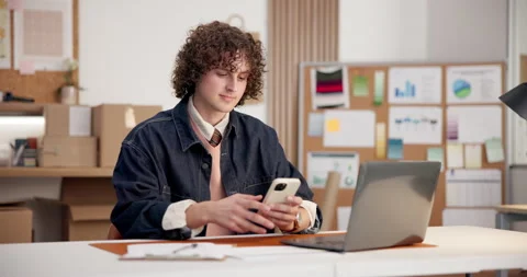 Ecommerce, man and typing in small business with phone, search customer data and Stock Footage 345701253
