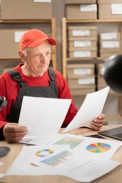 Ecommerce, sme and start up concept. senior man with documents reading order  스톡 사진