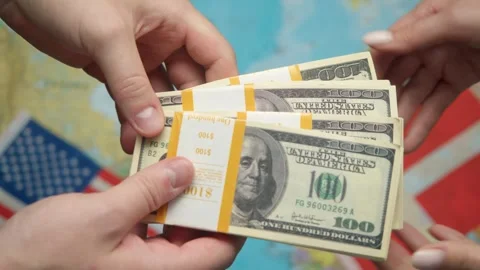 Economists conclude dollar transaction against maps and US-Danish flags for Stock Footage 331263538