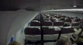 Economy class passengers sitting inside plane cabin. Air transport services HD Footage
