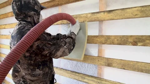 Ecowool insulation. Blowing into a frame wall Stock Footage 252364616