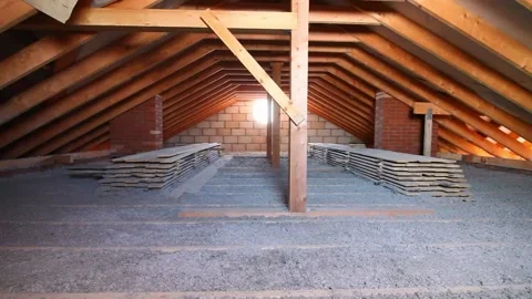 Ecowool insulation is poured in the attic Stock Footage 169316919