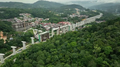 ECRL Gombak Area Construction Progress Amid Scenic Mountain Landscape Stock Footage 320752352