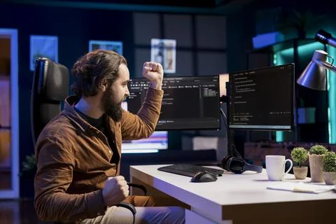 Ecstatic computer engineer celebrating after futureproofing company network 스톡 사진