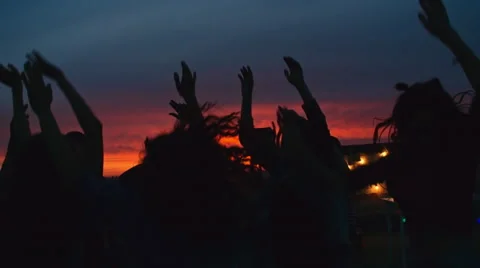 Ecstatic Crowd at Sunset Rooftop party Stock Footage