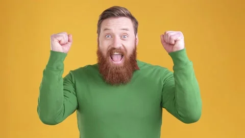 Ecstatic guy triumphant achieve yes fist up isolated bright color background 動画素材 170641464