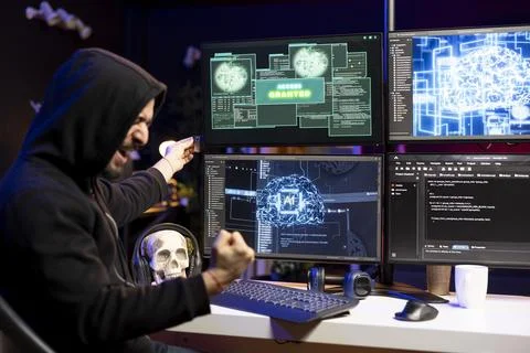 Ecstatic hacker celebrating after bypassing security using USB virus 写真素材