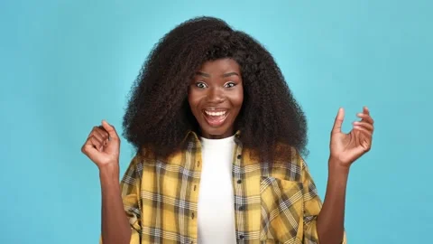 Ecstatic lady fists up shout yeah licky winner isolated blue color background Stock Footage 166157703
