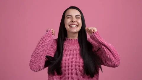 Ecstatic lady wait lottery win fists up isolated pastel pink color background Stock Footage 165862382