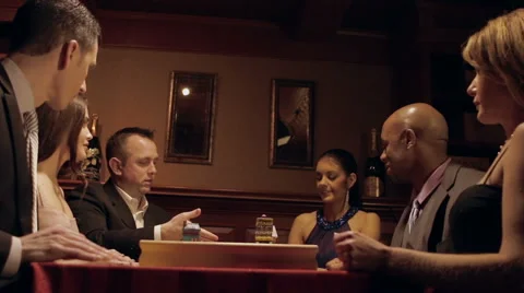 Ecstatic partygoers playing a board game Stock-Footage 42895295