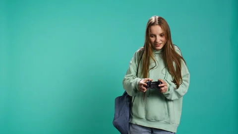 Ecstatic young girl using controller, Stock Video Pond5 - Main Image