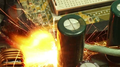 ECU burning and sparking computer components on moherboard Stock Footage 76453143