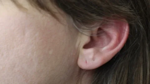 ECU of Cellphone Held to Ear Head Nodding Then Shaking No Then Cellular Lowered Stock Footage 87031038