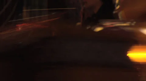 ECU fair ground spinning tea cup ride at night with slow shutter speed. Stock Footage 27638661