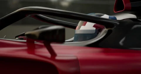 ECU Portrait of modern formula one  race car pilot driving fast during a race Stock Footage 245607672