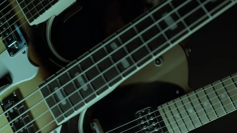 ECU SLIDER SHOT OF NONDESCRIPT ELECTRIC GUITARS.  4K, 10 BIT, 4;2;2. Stock Footage 124439964