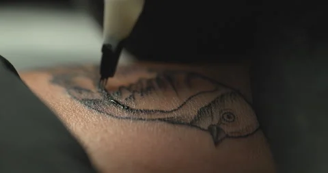 ECU of tattooing Stock Footage 154884048