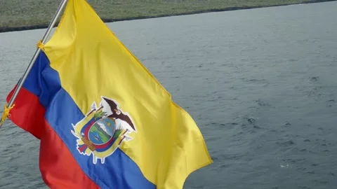 Ecuador flag waving with wind currents on back of boat on the ocean Stock Footage 340528384