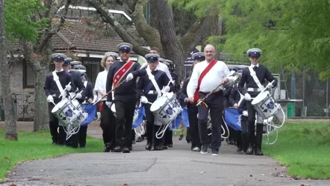 Ed Davey leads marching band at start of Lib Dem conference Stock Footage 317444850
