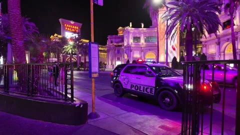 ED: LV, NV, US 8/25/25: Police Car With Lights Near Caesars Palace at Night Stock Footage 317264331