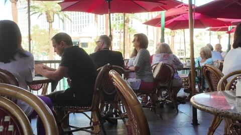 ED: LV, NV, US 8/25/25: Patrons Enjoy Dining Outdoors at a Las Vegas Restaurant Stock Footage 317469593