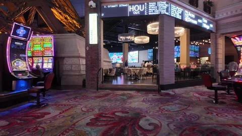 ED: LV, NV, US 8/25/25: Exploring the Vibrant Slot Machines at Paris Hotel Stock Footage 317470300