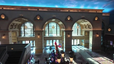 ED: LV, NV, US 8/25/25: Casino Entrance in Paris With Slot Machine and Sunlight Stock Footage 318314787