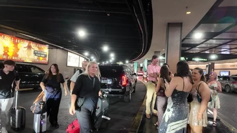ED: LV, NV, US 8/25/25: Women Waiting for Rides Near Planet Hollywood in Las Stock Footage 318370540