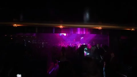 ED: LV, NV, US 8/25/25: VIP Staff Check Invitations at a Lively Nightclub 動画素材 318540794