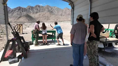 ED: LV, NV, US 8/25/25: People Practice Shooting on Gun Range in Desert Setting Stock-Footage 318616965
