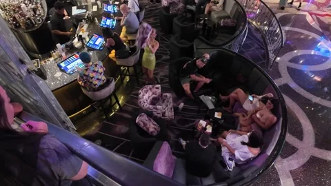 ED: LV, NV, US 8/25/25: Friends Enjoying Time Under a Chandelier in Las Vegas Stock Footage 318924938