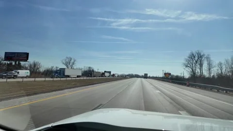 ED: Port Huron, MI, USA 3/21/2025: Long Line of Trucks Waiting at Michigan Stock Footage 332131651