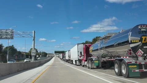 ED: Sarnia, ON, CA 10/01/2024: Driving Past Transport Trucks in Sarnia on a Stock Footage 342670141