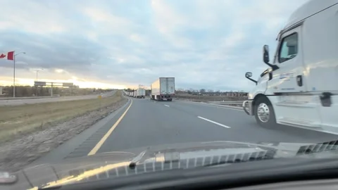 ED: Sarnia, ON, CAD 11/11/2025: Long Line of Trucks at USA Canada Border Stock Footage 332010917