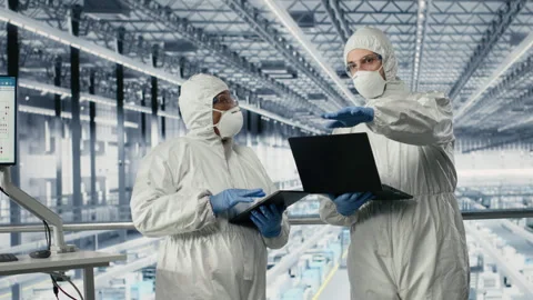 EDA engineers in microchip smart factory developing advanced electronics Stock Footage 333387871