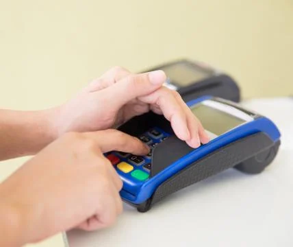 EDC ( electronic Data Capture) machine hand pressing password on 스톡 사진