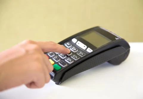EDC ( electronic Data Capture) machine hand pressing password on 스톡 사진