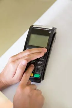 EDC ( electronic Data Capture) machine hand pressing password on 스톡 사진