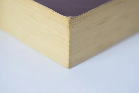 Edge of book on white background Stock Photos
