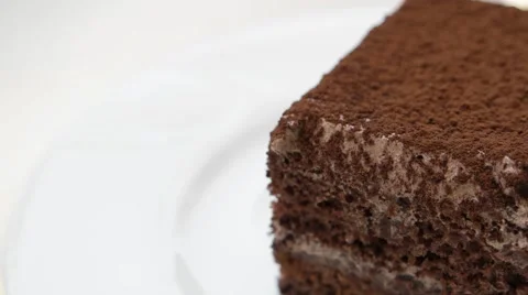 Edge of chocolate cake with cocoa powder Stock Footage 54342056