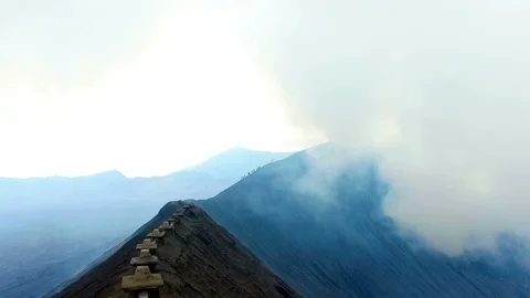 On the edge from the crater from the Bromo volcano on Java Indonesia Stock Footage 87307025