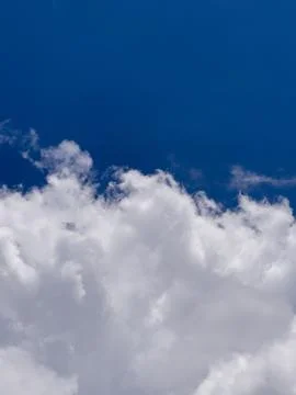 The edge of a cumulus cloud with blue sky Stock Photos