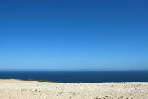 Edge of Espichel Cape facing the Atlantic Ocean horizon Stock Photos