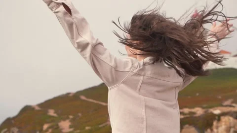 Edge of Europe,Cabo da Roca,lighthouse. ocean and wind. young woman tourist Stock Footage 157931781