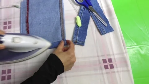 Edge of jeans, ironing Stock Footage 79630673