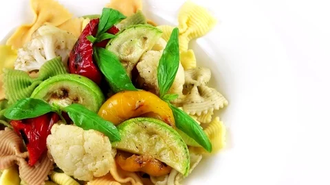 Edge of plate with Bowtie pasta, copy space in right side Stock Footage 73654662